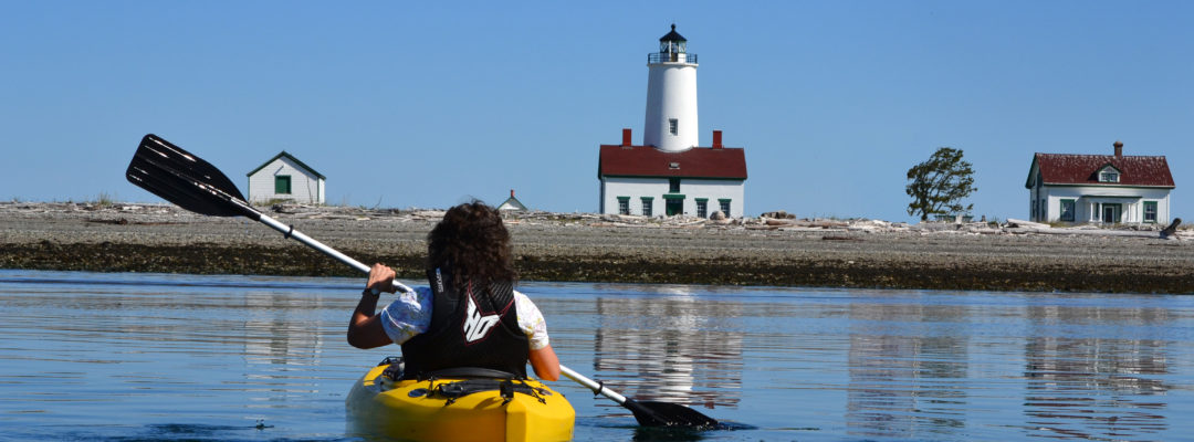 Kayaker and Dungeness Lighthouse